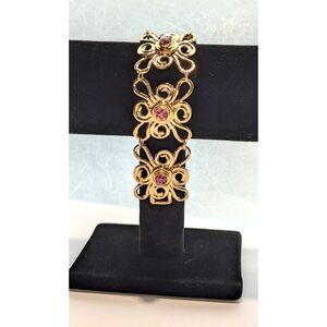 Abstract Gold Tone Flower Bracelet with Pink Center Stone Avon